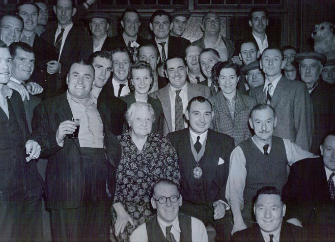 Richard Cobden Festival Dart Match 1951 � W.G. Humphries JP Mayor of Stepney�. On the back it says �Mr Reay�. Alice Reay is the woman sitting next to the Mayor.