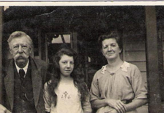 These are my Great Grandparents Thomas & Minnie Robertson, who were landlords of The Black Swan Circa 1902 to 1936. I was informed by my Grandfather that it is taken in the Porch of the Black Swan. The young girl with them is my grandfathers younger sister.