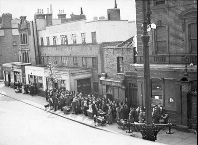Queens Arms, Spa Road, Bermondsey - circa 1946 with people queuing for bread in Spa Road after the war