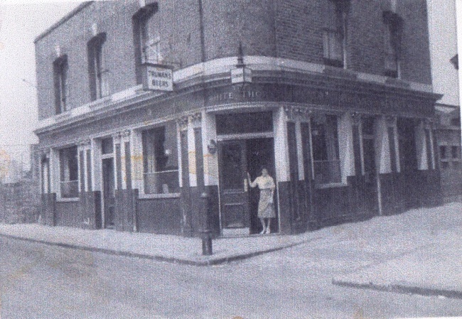 Whitethorn, 30 Whitethorn Street, Bow E3 with Hannah Ervin standing in the doorway around 1954-58. 