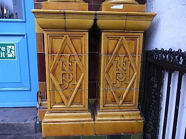 Red Lion tiled pilasters, Fulham Road - in 2009 showing monogram J H S 