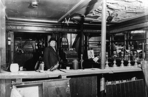 My Grandad - Richard Bernard Tillcock - behind the bar at The Two Blue Posts, taken at the time of the blitz and the pub was thereafter structurally unsound. I remember it as a bomb site as were all the buildings running to its left.