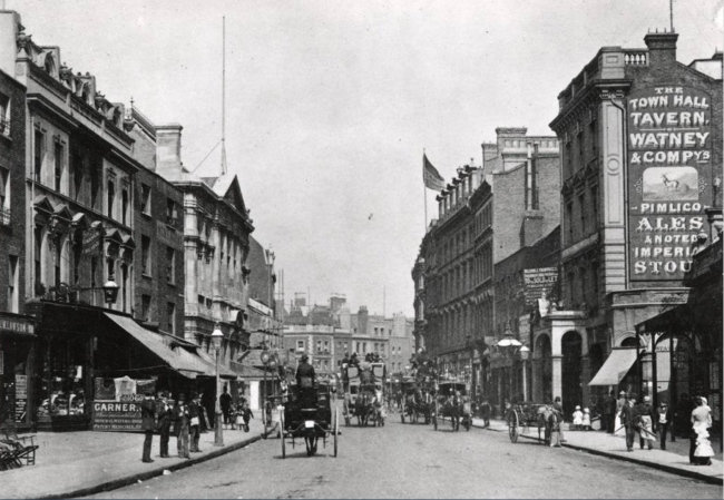 Kensington High Street circa 1893, on the right is the pub, now called The Town Hall Tavern and halfway down the left side of the street, with the pediment and flagpole is the building from which it took its name, Kensington Town Hall opened in 1880.