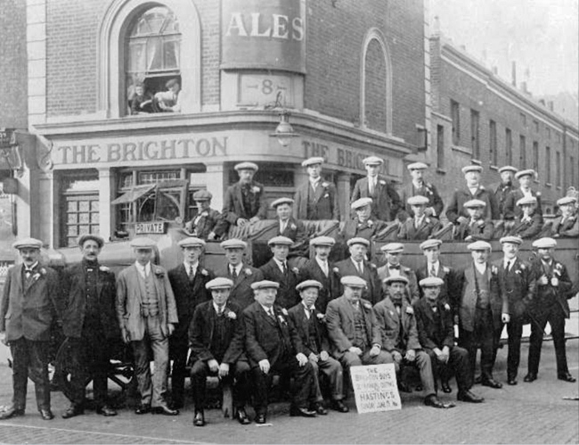 The Brighton, Old Kent Road at the corner of Buckenham Street. The charabanc is taking the Brighton Boys, (oddly) to Hastings, in 1921.