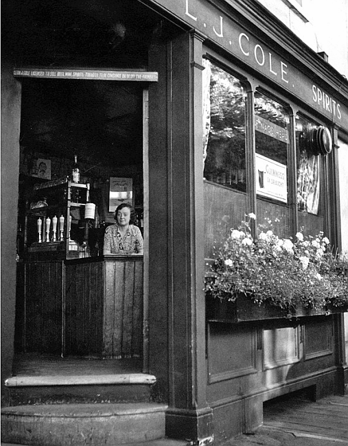 Nags Head, 53 Kinnerton Street - in 1962 with Eva Cole behind the bar