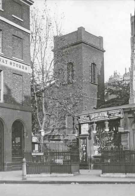 The current building dates from 1829. In March 1926 showing St Katherine Coleman church shortly before its demolition. The pub is on the left, its name is partially missing, but ends ''.....AY STORES'.