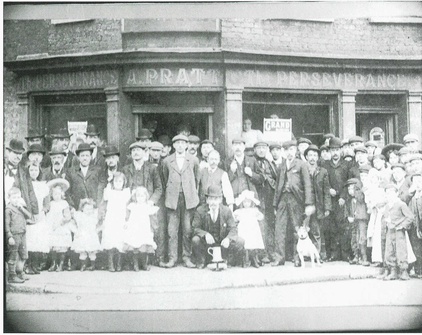 A family photograph that belongs to my grandmother (nee Pratt) We have dated the photograph to around 1910. My grandmother says that she was inside the pub when the picture was taken (yes she will be 100 years old this December - 2006) and it was taken after a boxing match she thinks. The name A Pratt above the door is in reference to William Charles Pratt's mother. The pub belonged to his father William Pratt and he died in 1883 and left his estate to Anne Pratt. William Charles Pratt died in 1910. **