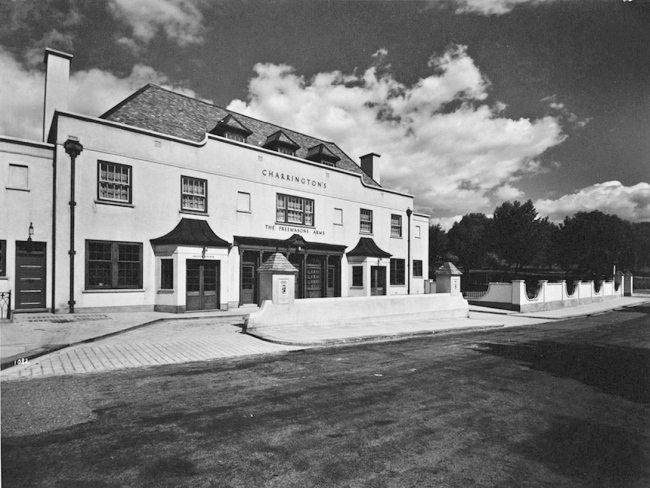 The Freemasons Arms, Downshire Hill at the corner of Willow Road, in 1936 and is the newly rebuilt pub. The architect was S C Clark. The cost was £15,600. The car park was an extra cost of £807. The landlord is Bernard Levy.