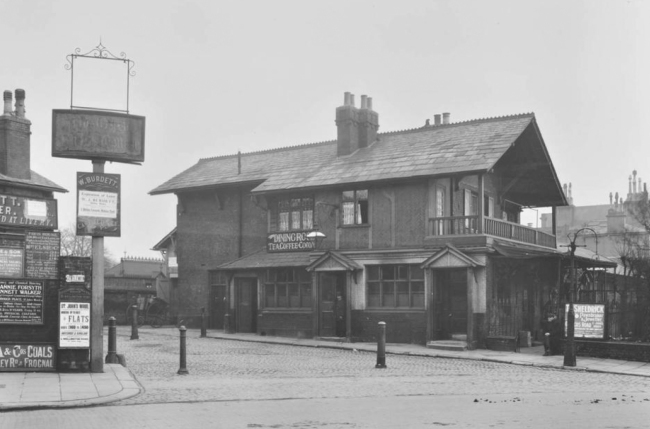 Ye Olde Swiss Cottage at the junction of Finchley Road and Avenue Road, and shows the original building before the 1960s rebuild, in 1912.